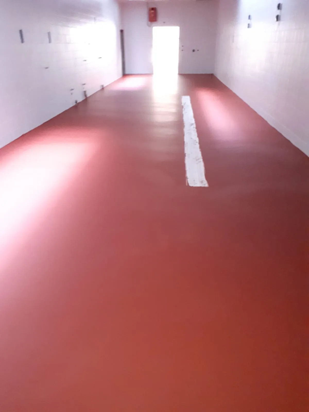 pavimentazione colorata in poliuretano-cemento Sika Ucrete per celle di lavorazione GDO